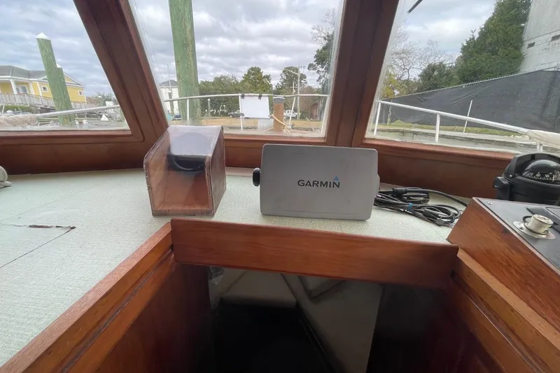 Slide: The Image of 1991 Marine Trader 34 Double Cabin helm with Garmin navigation system and compass. - 14