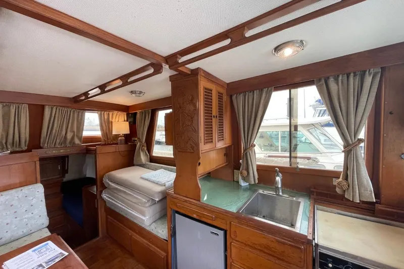 Slide: The Image of Interior of 1991 Marine Trader 34 Double Cabin with wood finish and kitchenette. - 19