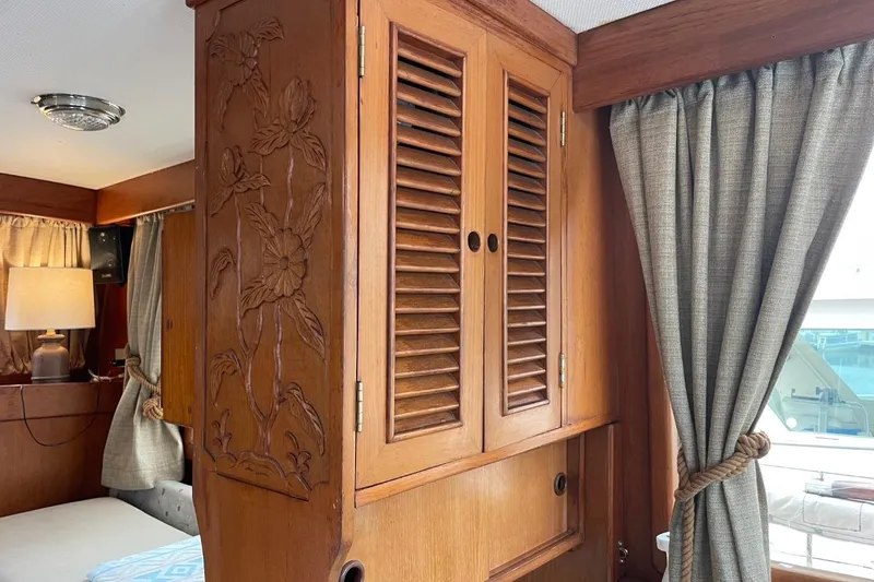 Slide: The Image of Wooden interior of 1991 Marine Trader 34 Double Cabin with carved floral design. - 37