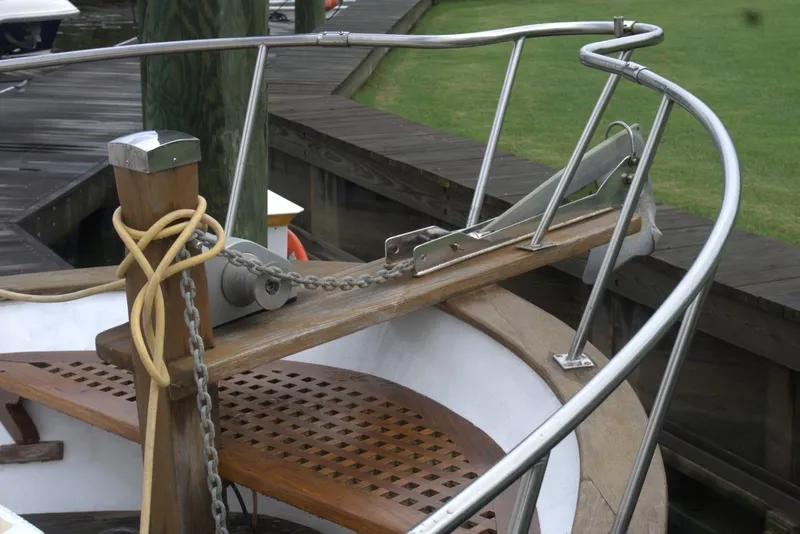Slide: The Image of Bow of 1991 Marine Trader 34 Double Cabin with anchor chain and railing. - 66