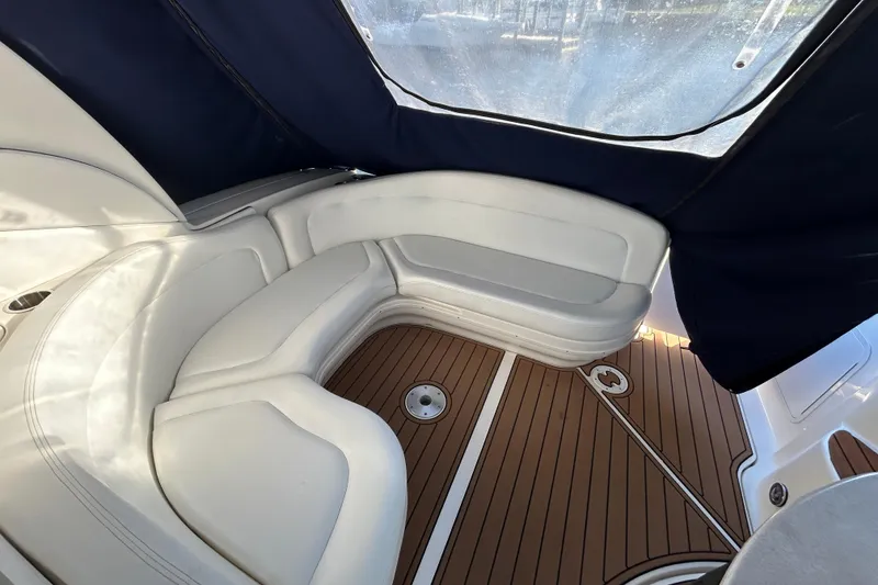 Slide: The Image of Luxurious seating area on 2006 Sea Ray 320 Sundancer boat with wood flooring. - 10