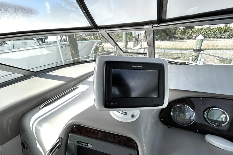 Slide: The Image of Helm of 2006 Sea Ray 320 Sundancer with Raymarine navigation display. - 14