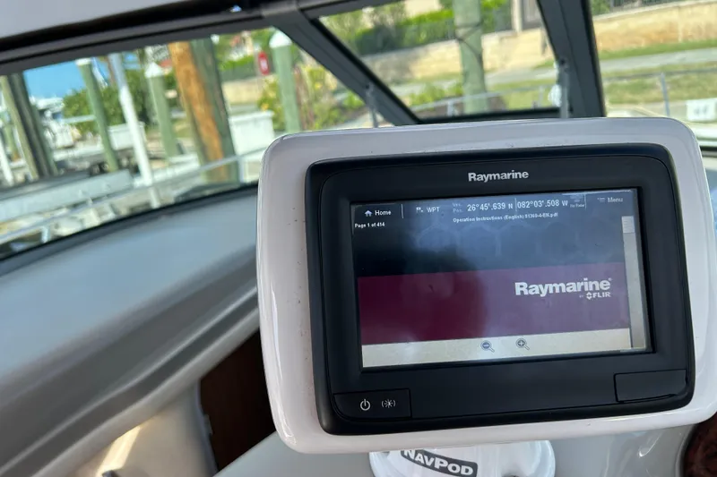 Slide: The Image of Raymarine navigation system on 2006 Sea Ray 320 Sundancer boat dashboard. - 15