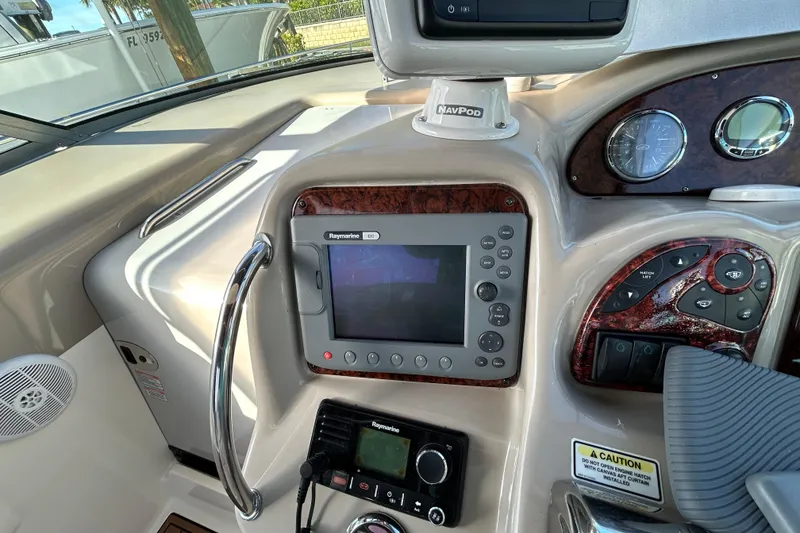 Slide: The Image of Control panel of a 2006 Sea Ray 320 Sundancer boat with navigation equipment. - 16