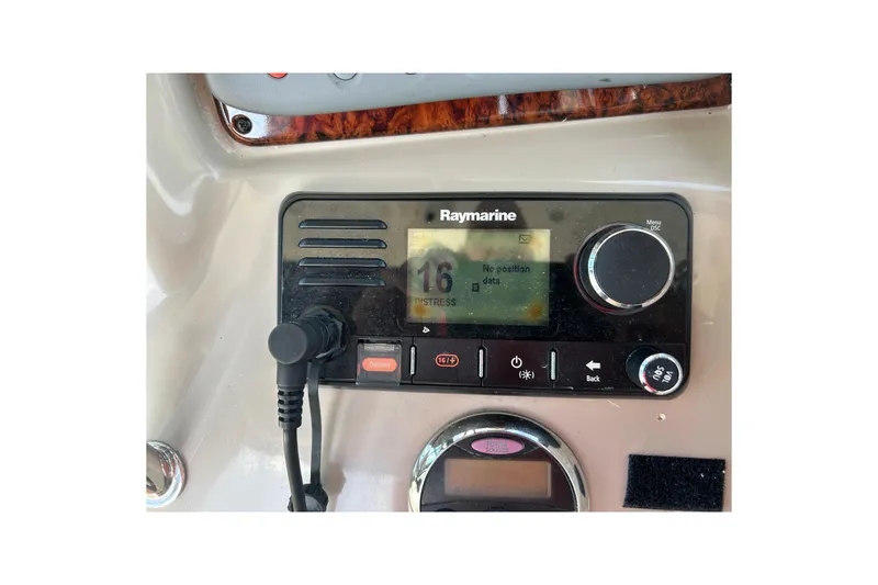 Slide: The Image of Raymarine marine radio on 2006 Sea Ray 320 Sundancer dashboard. - 18