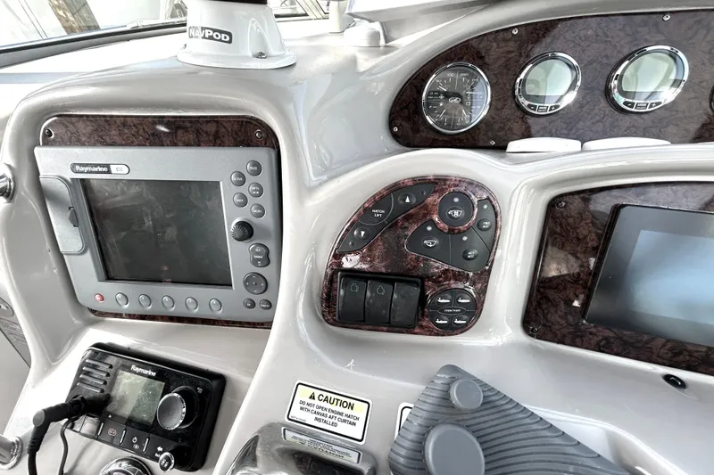 Slide: The Image of Control panel of a 2006 Sea Ray 320 Sundancer boat with navigation equipment. - 21
