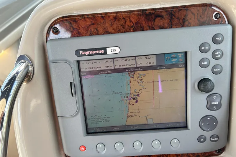 Slide: The Image of Raymarine C80 navigation system on 2006 Sea Ray 320 Sundancer boat dashboard. - 22