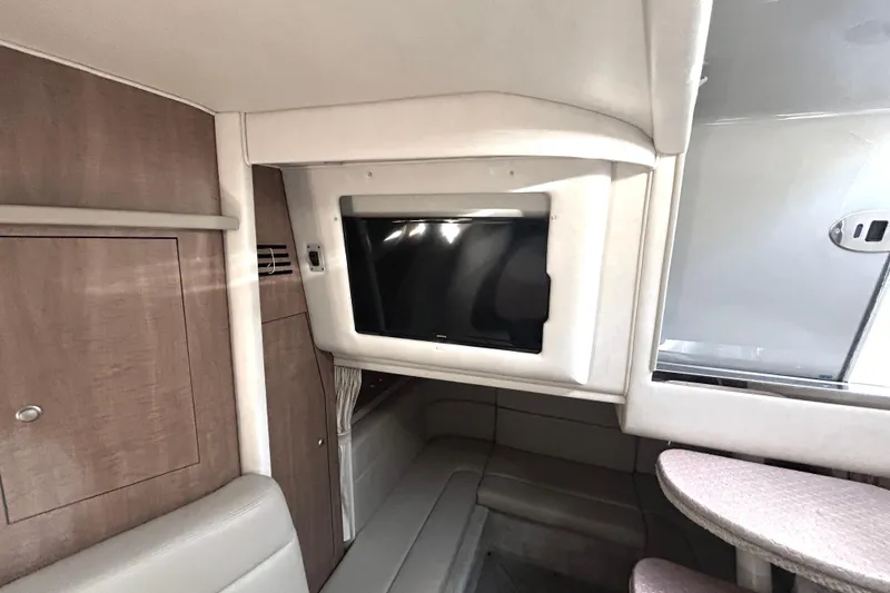 Slide: The Image of Interior of 2006 Sea Ray 320 Sundancer with TV and seating area. - 27