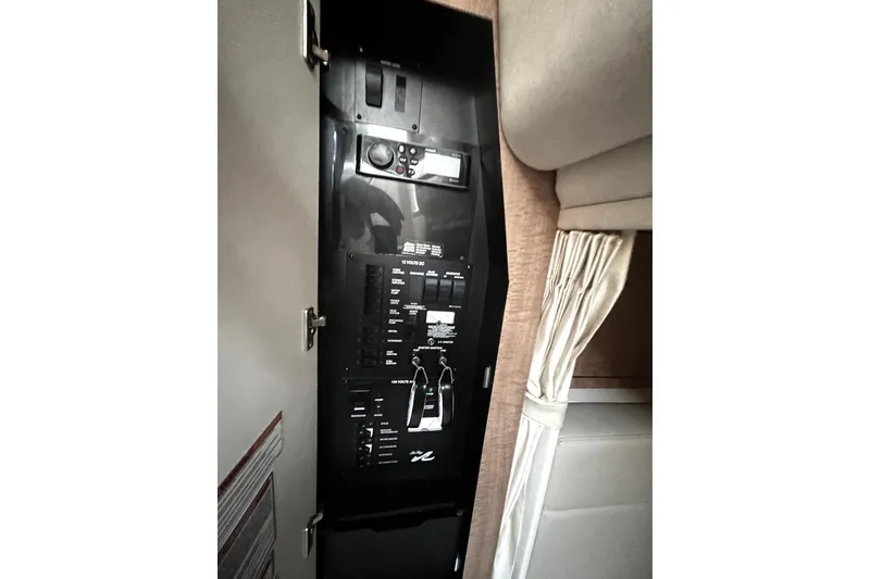 Slide: The Image of Electrical control panel inside 2006 Sea Ray 320 Sundancer boat cabin. - 39