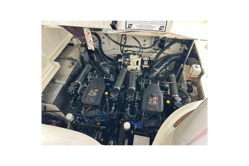Slide: The Image of Engine compartment of a 2006 Sea Ray 320 Sundancer boat, showcasing dual engines. - 45