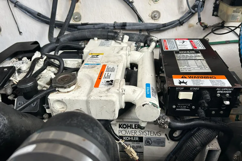 Slide: The Image of Engine compartment of a 2006 Sea Ray 320 Sundancer with Kohler power systems. - 46