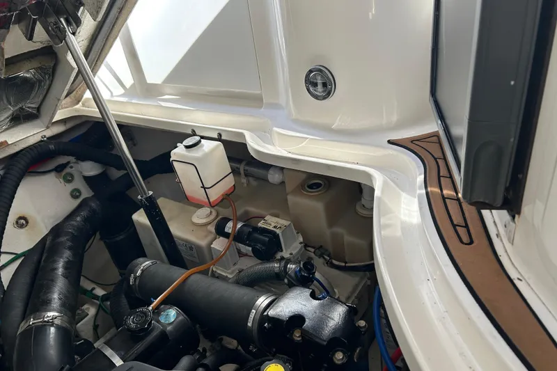 Slide: The Image of Engine compartment of a 2006 Sea Ray 320 Sundancer boat, showing mechanical components. - 51
