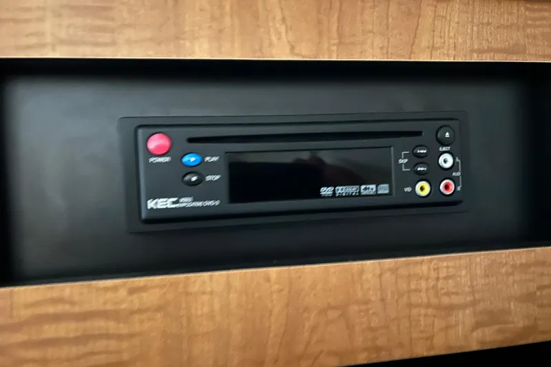 Slide: The Image of KEC DVD player in 2006 Sea Ray 320 Sundancer boat interior. - 57