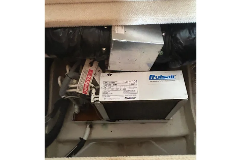 Slide: The Image of Cruisair unit in 2006 Sea Ray 320 Sundancer boat, showing ventilation system components. - 60