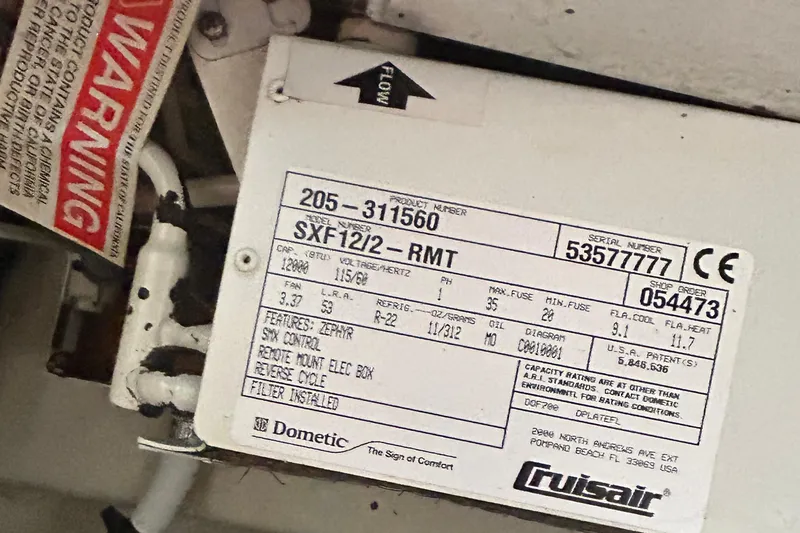 Slide: The Image of Label on a Dometic Cruisair unit in a 2006 Sea Ray 320 Sundancer boat. - 61