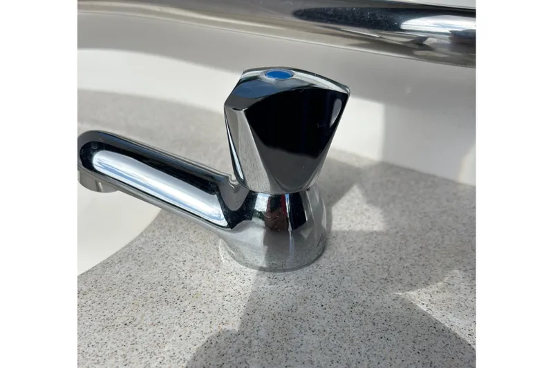 Slide: The Image of Chrome faucet on Sea Ray 320 Sundancer 2006 boat countertop. - 71