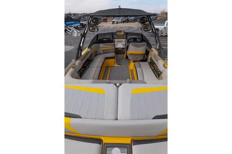 Slide: The Image of 2014 Malibu Wakesetter 24 MXZ interior with gray and yellow seating, featuring a sleek design. - 10