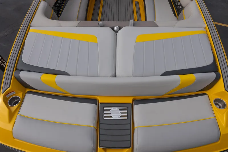 Slide: The Image of 2014 Malibu Wakesetter 24 MXZ boat interior with yellow and gray seating. - 11