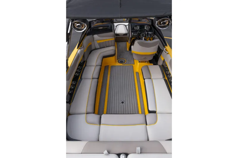 Slide: The Image of 2014 Malibu Wakesetter 24 MXZ interior with gray and yellow seating, sleek design. - 12