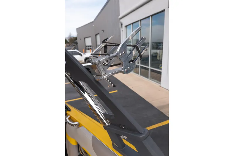 Slide: The Image of 2014 Malibu Wakesetter 24 MXZ wakeboard rack detail, parked near a building. - 13