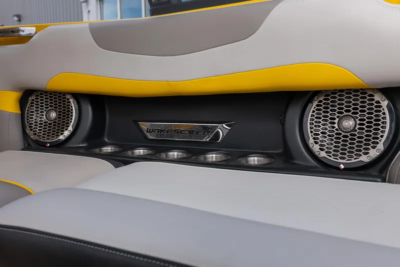 Slide: The Image of 2014 Malibu Wakesetter 24 MXZ interior with speakers and cup holders. - 14