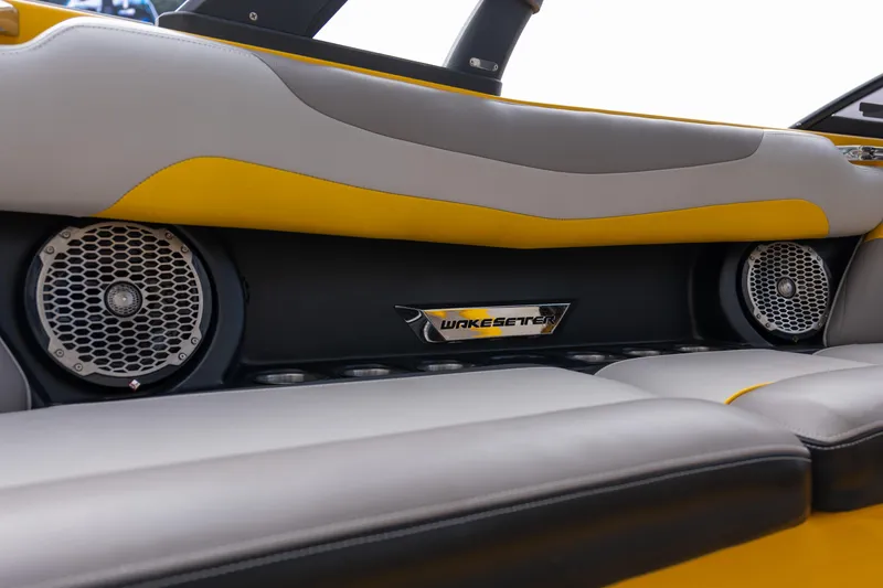 Slide: The Image of 2014 Malibu Wakesetter 24 MXZ interior with speakers and stylish seating. - 15