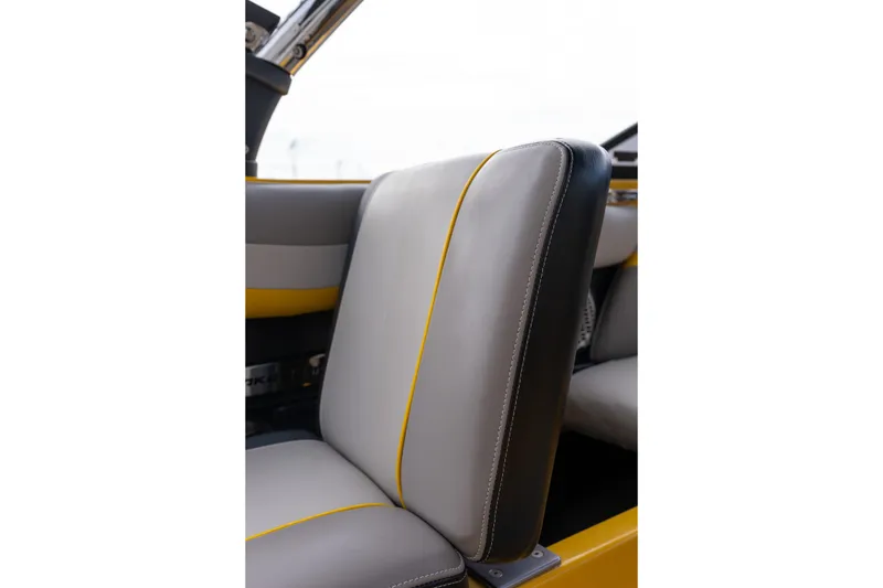 Slide: The Image of 2014 Malibu Wakesetter 24 MXZ interior seat with gray and yellow accents. - 23