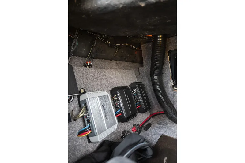 Slide: The Image of Audio system components inside a 2014 Malibu Wakesetter 24 MXZ boat. - 24