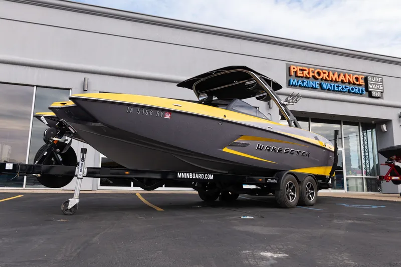 Slide: The Image of 2014 Malibu Wakesetter 24 MXZ boat on trailer at Performance Marine Watersports dealership. - 25