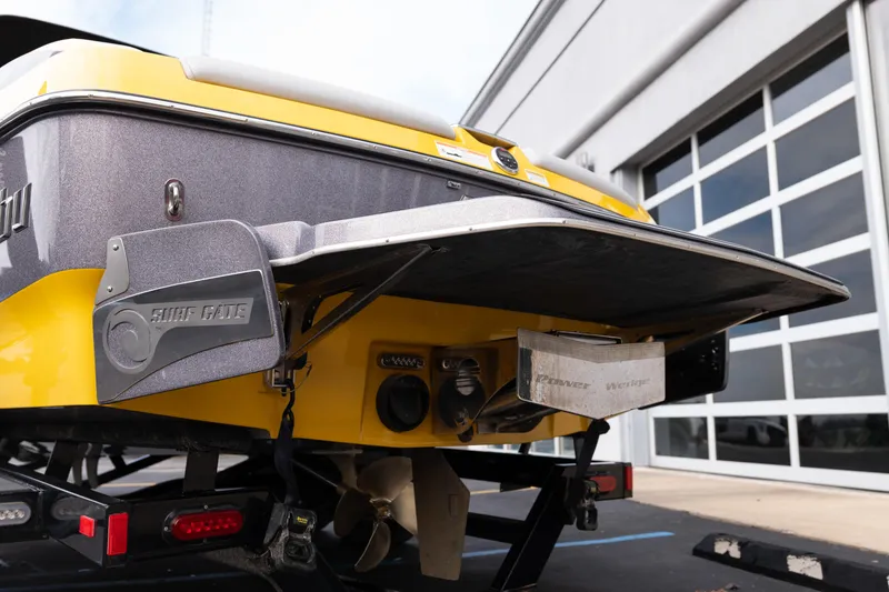 Slide: The Image of 2014 Malibu Wakesetter 24 MXZ boat rear view with Surf Gate technology. - 28