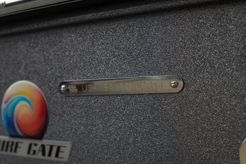 Slide: The Image of 2014 Malibu Wakesetter 24 MXZ boat with Surf Gate logo and identification plate. - 6