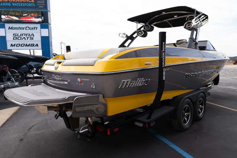Slide: The Image of 2014 Malibu Wakesetter 24 MXZ boat in yellow and gray on trailer. - 7