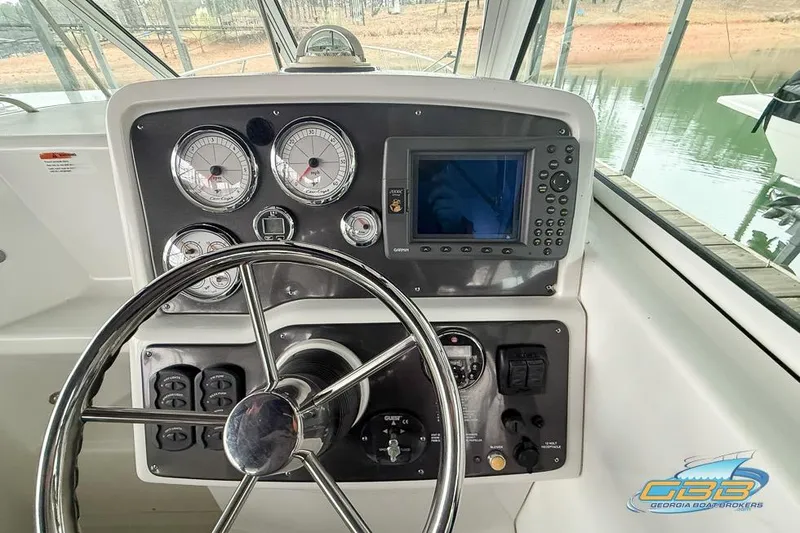 Slide: The Image of Steering console of 2001 Chris-Craft 26 Constellation boat with gauges and navigation system. - 10