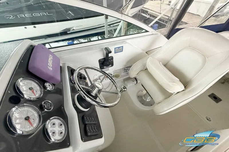 Slide: The Image of Helm of 2001 Chris-Craft 26 Constellation with steering wheel and gauges. - 11