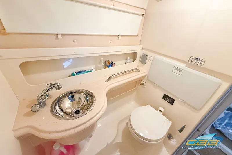Slide: The Image of 2001 Chris-Craft 26 Constellation boat bathroom with sink and toilet. - 12