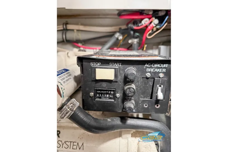 Slide: The Image of Control panel of a 2001 Chris-Craft 26 Constellation boat with circuit breaker and switches. - 27