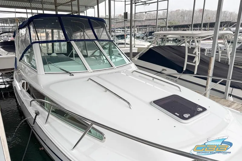 Slide: The Image of 2001 Chris-Craft 26 Constellation boat docked in a marina. - 4