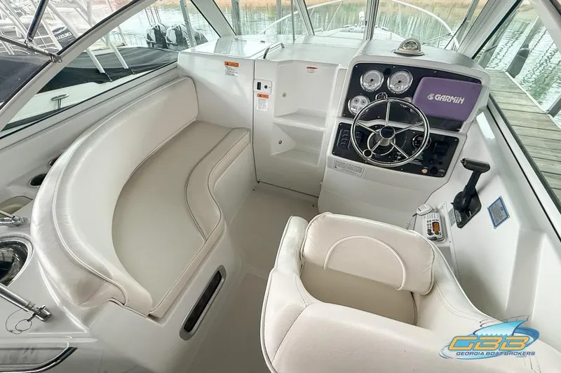 Slide: The Image of 2001 Chris-Craft 26 Constellation boat interior with helm, seating, and navigation equipment. - 8