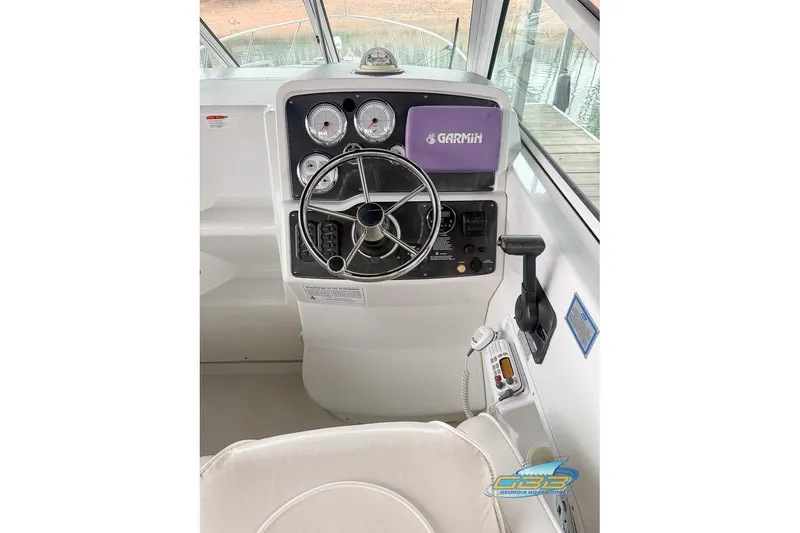 Slide: The Image of Helm of 2001 Chris-Craft 26 Constellation with Garmin navigation system and control panel. - 9