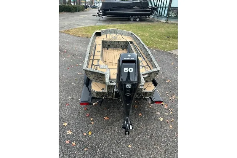 Slide: The Image of 2026 Tracker Grizzly 1756 T Marsh boat with Mercury 60 outboard motor on trailer. - 8