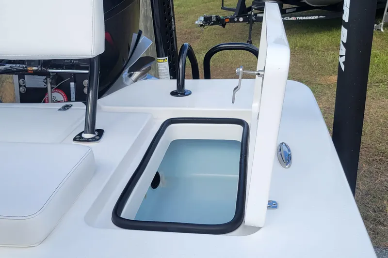 Slide: The Image of 2026 Blazer 675 Ultimate Bay boat with open storage compartment on deck. - 10