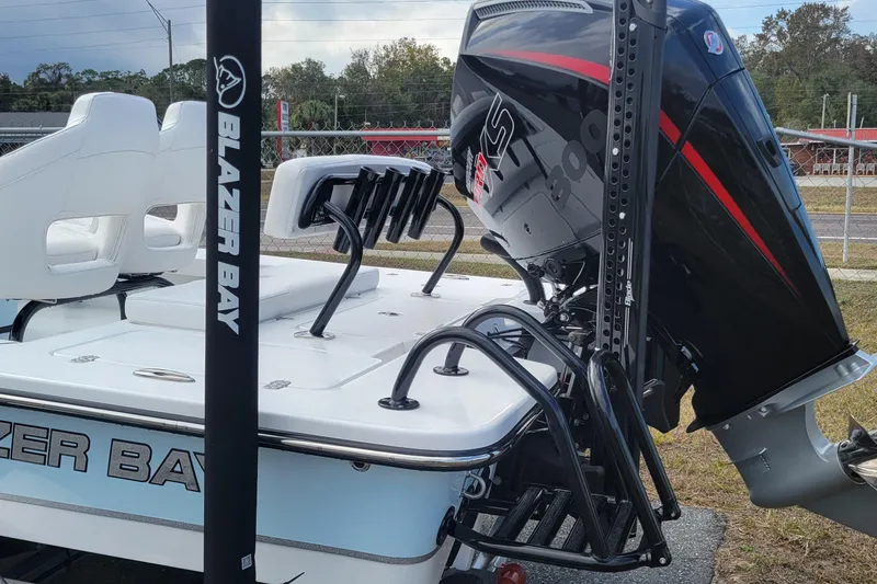 Slide: The Image of 2026 Blazer 675 Ultimate Bay boat with powerful outboard motor and sleek design. - 5