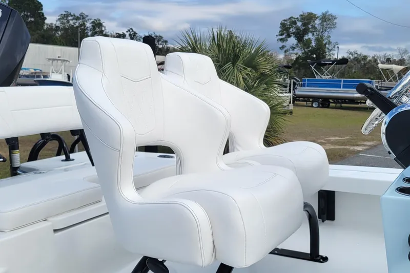 Slide: The Image of White seats on 2026 Blazer 675 Ultimate Bay boat, outdoor setting. - 8