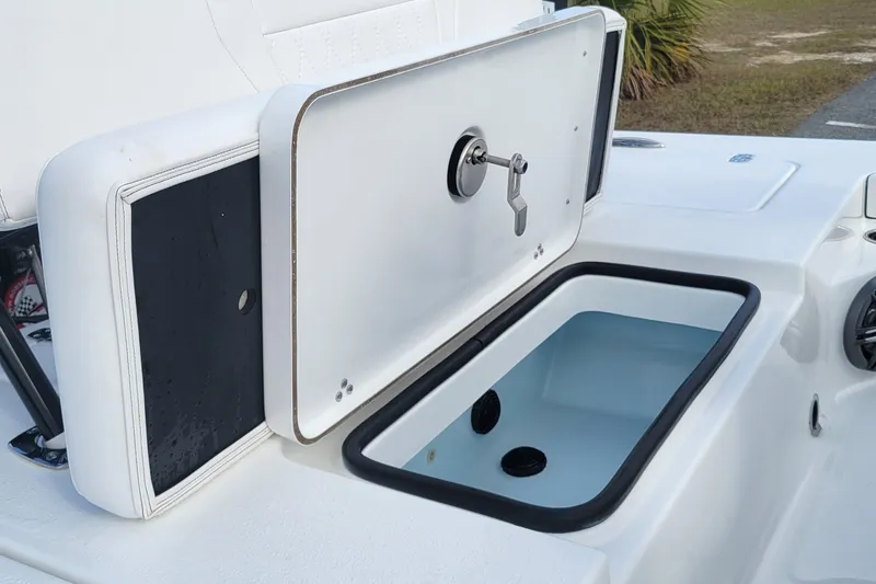 Slide: The Image of 2026 Blazer 675 Ultimate Bay boat storage compartment with open lid and latch. - 9