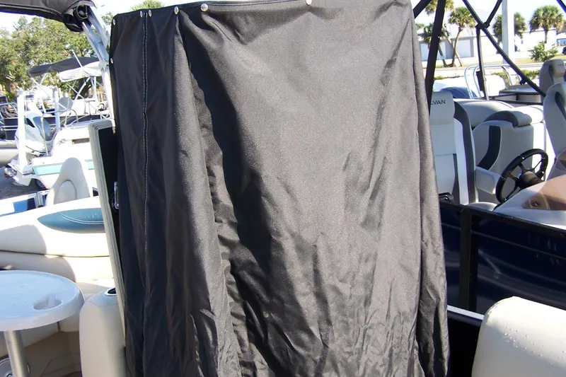 Slide: The Image of 2019 Sylvan 8520 Mirage F-n-C boat with black privacy curtain on deck. - 10