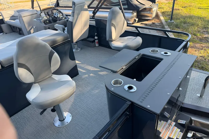 The Image of 2026 Avalon VENTURE CC boat interior with seating and fishing station. - 1