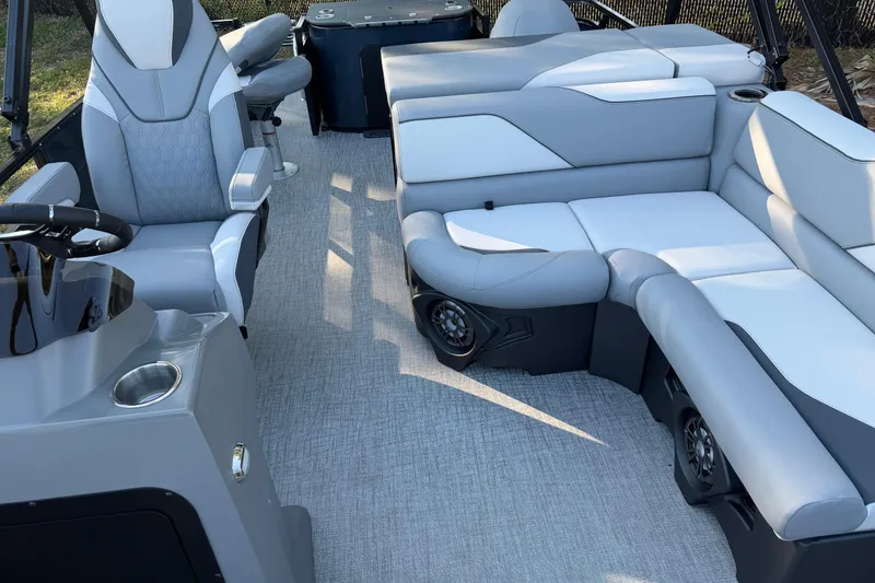 Slide: The Image of 2026 Avalon VENTURE CC boat interior with modern seating and steering console. - 3