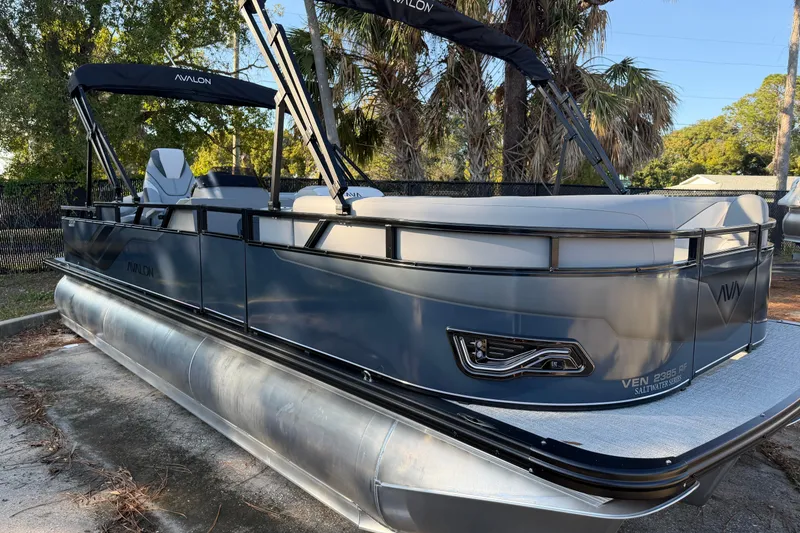Slide: The Image of 2026 Avalon VENTURE CC pontoon boat with sleek design and modern features. - 6