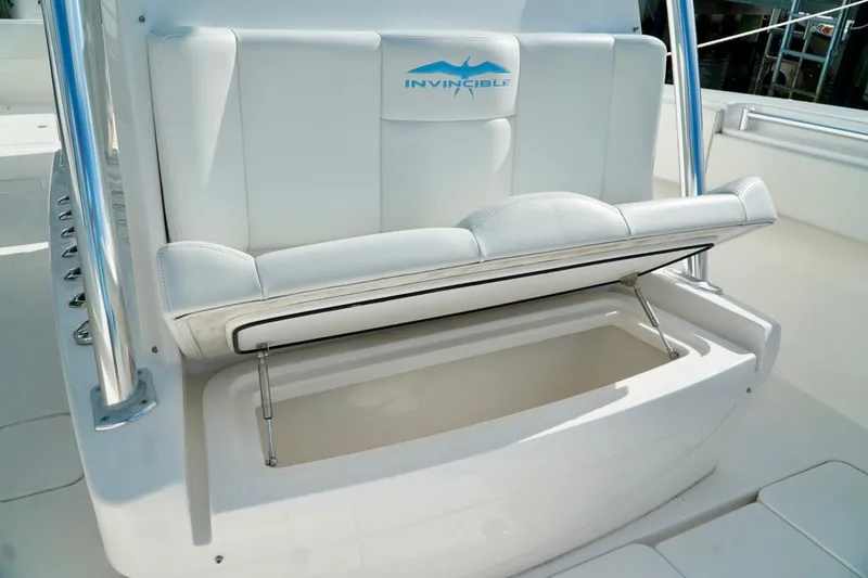 Slide: The Image of White Invincible boat seat with storage compartment, featuring sleek design and durable materials. - 18