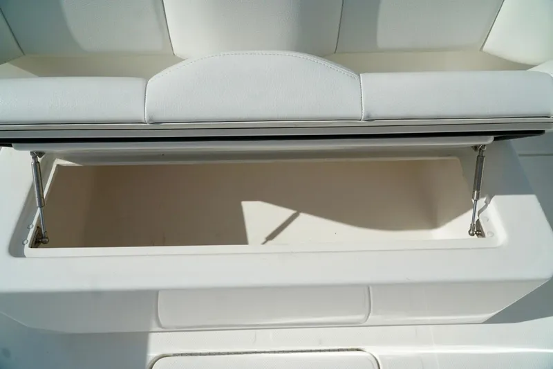 Slide: The Image of White boat seat with open storage compartment, Invincible make. - 19